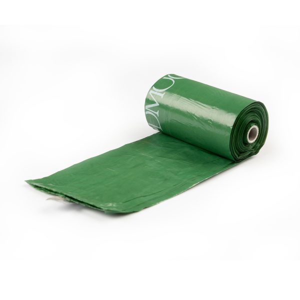 Green poop bag in roll