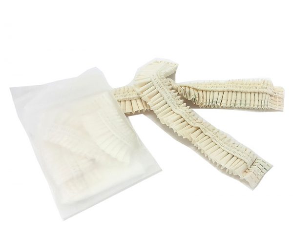 Compostable shower caps individually packaged in compostable pouches